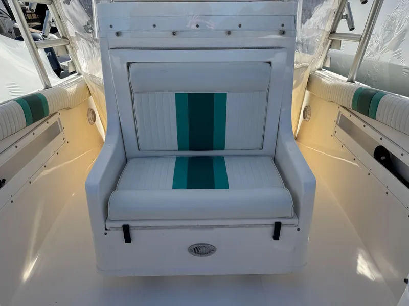Slide: The Image of 1999 Marlin 350 SF boat seat with teal and white upholstery. - 12
