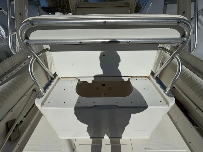 Slide: The Image of 1999 Marlin 350 SF boat interior with seating and storage compartment. - 22