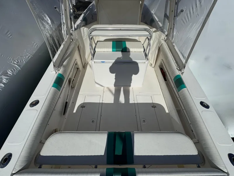 Slide: The Image of 1999 Marlin 350 SF boat interior with seating and shadow on deck. - 25