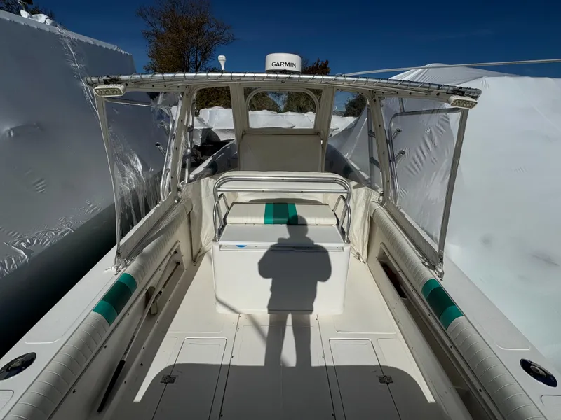 Slide: The Image of 1999 Marlin 350 SF boat interior with seating and Garmin equipment. - 26
