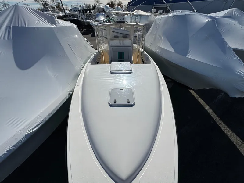 Slide: The Image of 1999 Marlin 350 SF boat, top view, docked between covered boats. - 4