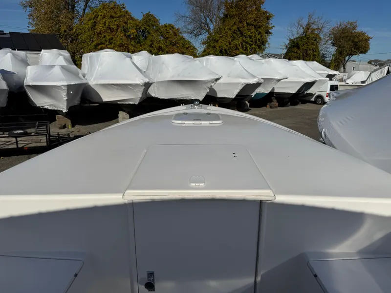 Slide: The Image of 1999 Marlin 350 SF boat in storage, surrounded by covered boats. - 6