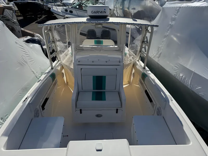 Slide: The Image of 1999 Marlin 350 SF boat interior with Garmin equipment, docked and covered. - 8