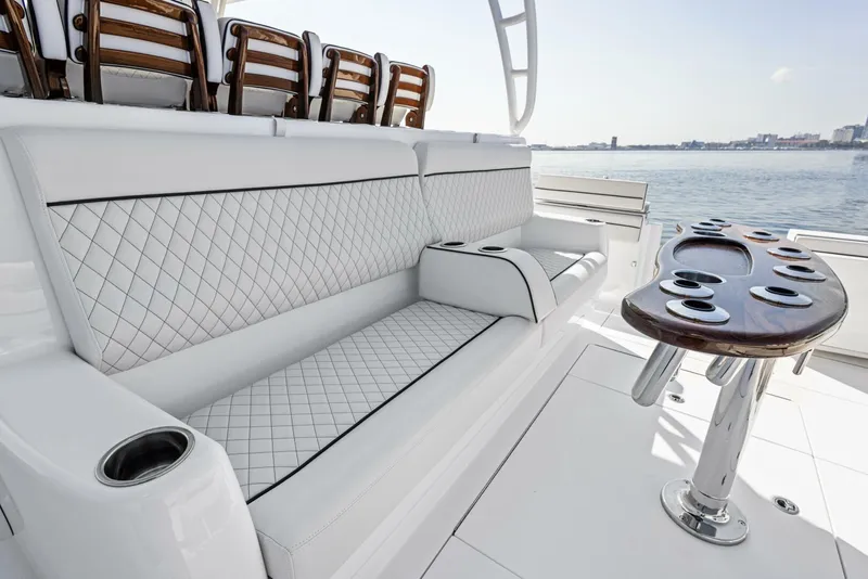Slide: The Image of Luxurious seating on 2024 Valhalla Boatworks V55, featuring diamond-stitched upholstery and sleek design. - 10