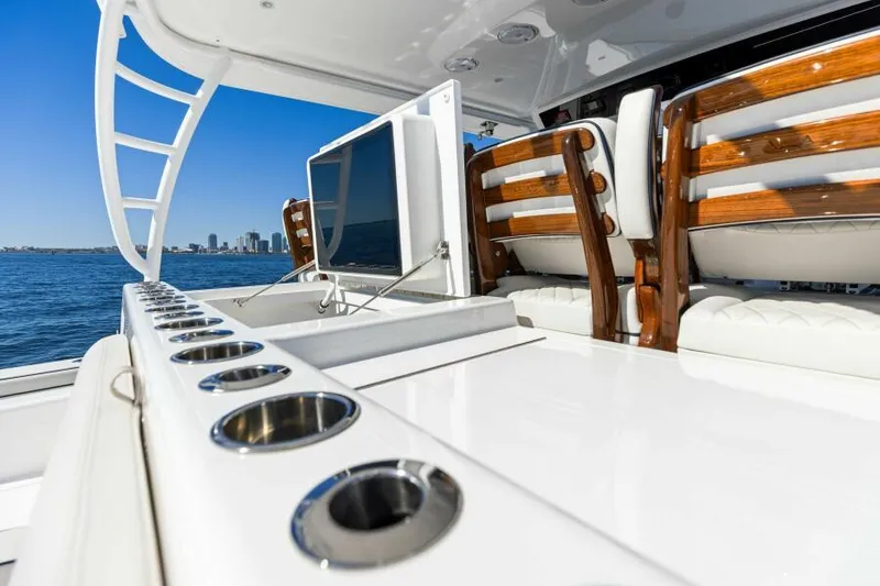 Slide: The Image of 2024 Valhalla V55 boat deck with seating and rod holders, ocean view. - 11