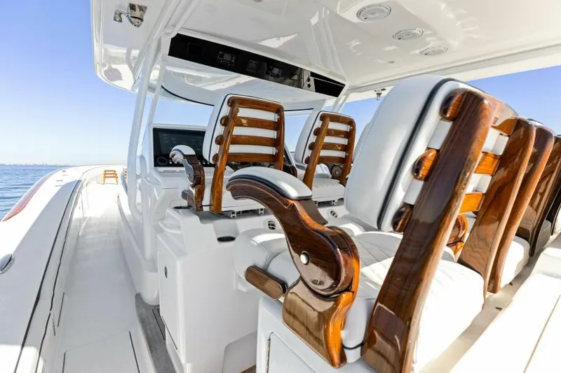 Slide: The Image of Luxurious 2024 Valhalla V55 boat interior with elegant wooden seating and modern design. - 12