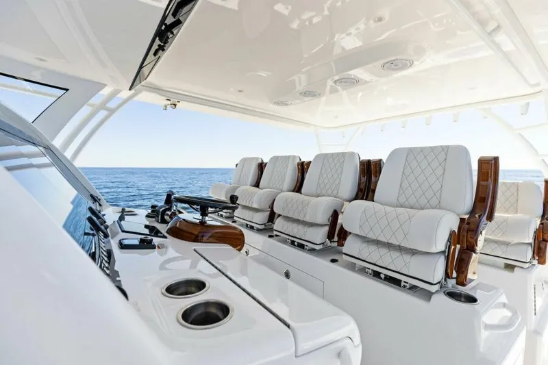 Slide: The Image of Luxurious 2024 Valhalla V55 boat interior with plush seating and ocean view. - 14