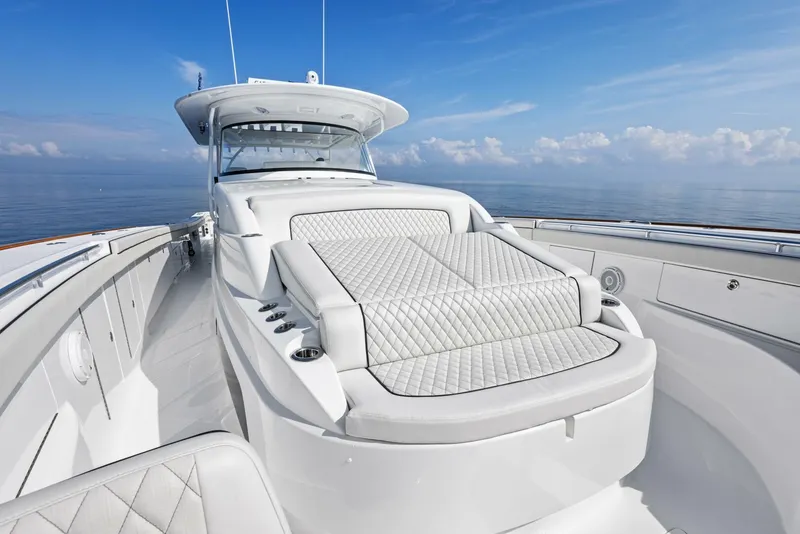 Slide: The Image of 2024 Valhalla V55 boat with luxurious deck seating and ocean view. - 24