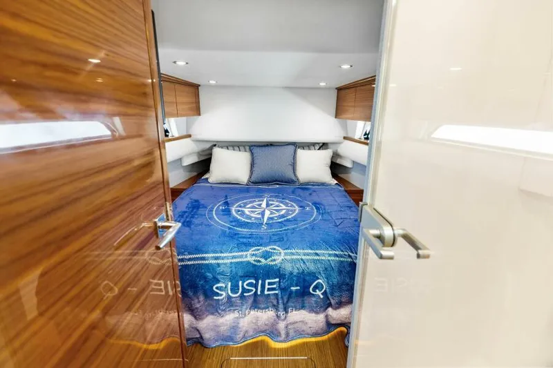 Slide: The Image of Luxurious 2024 Valhalla V55 boat cabin with cozy bed and nautical decor. - 31