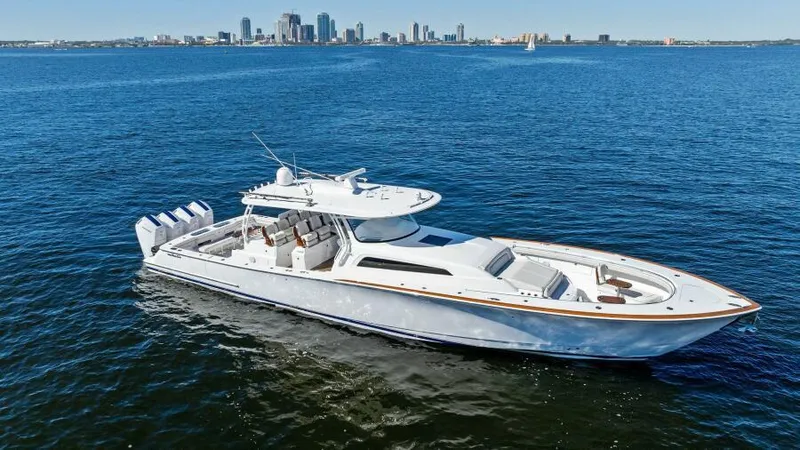 Slide: The Image of 2024 Valhalla Boatworks V55 luxury yacht cruising on open water. - 45