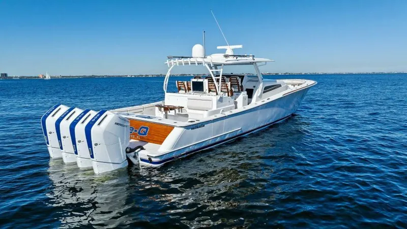 Slide: The Image of 2024 Valhalla Boatworks V55 on open water, featuring four powerful outboard engines. - 50