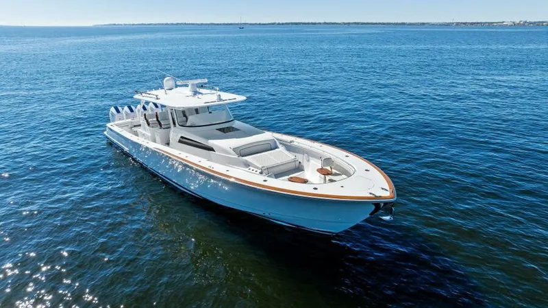 Slide: The Image of 2024 Valhalla Boatworks V55 luxury boat cruising on open water. - 51