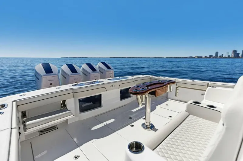 Slide: The Image of 2024 Valhalla Boatworks V55 on open water, featuring spacious deck and powerful engines. - 7