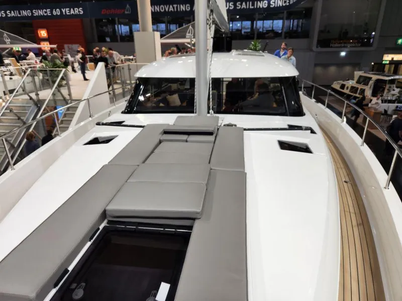 Slide: The Image of 2025 Moody 48 DS yacht with sleek deck design at a boat show. - 11
