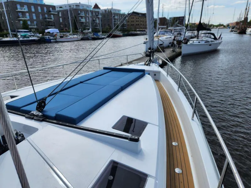 Slide: The Image of Deck view of 2025 Moody 48 DS yacht docked in a marina. - 15