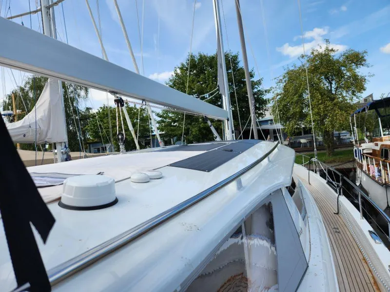 Slide: The Image of Sailing yacht Moody 48 DS, 2025 model, docked with clear blue sky. - 16