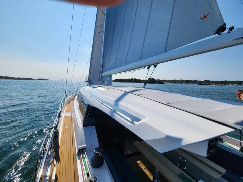 Slide: The Image of Sailing on a 2025 Moody 48 DS yacht in sunny waters. - 18
