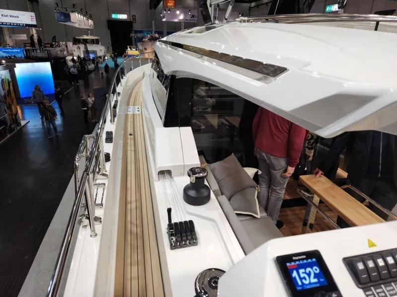 Slide: The Image of 2025 Moody 48 DS yacht interior with modern design and navigation display. - 19
