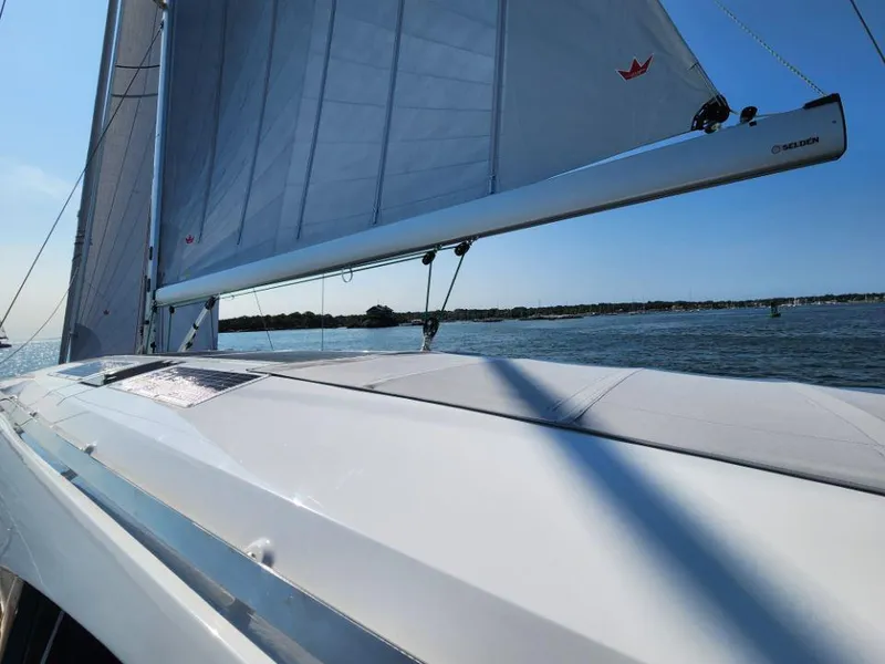 Slide: The Image of Sailing on a 2025 Moody 48 DS yacht with clear skies and calm waters. - 24