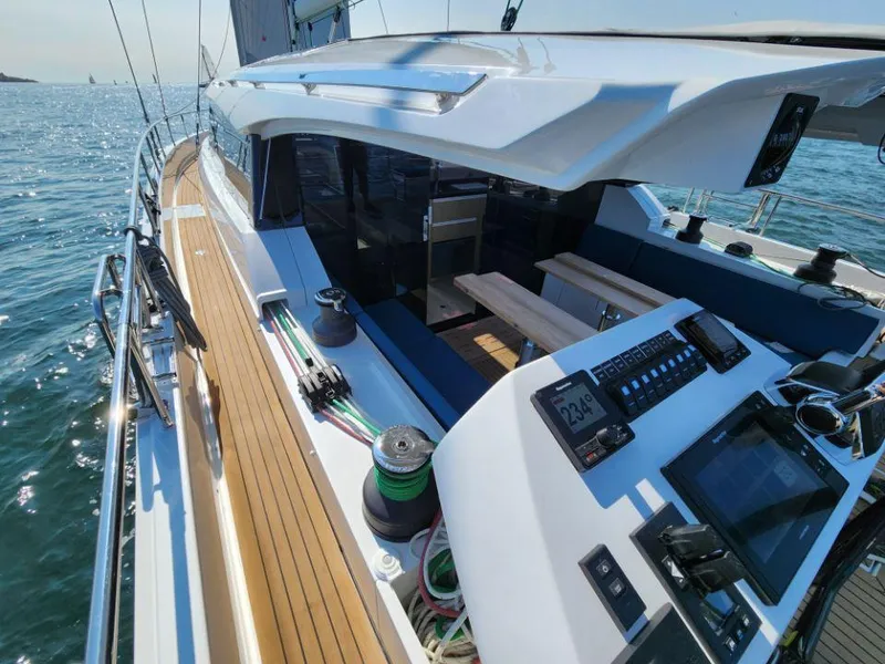 Slide: The Image of 2025 Moody 48 DS yacht with sleek deck and modern navigation controls on open water. - 25