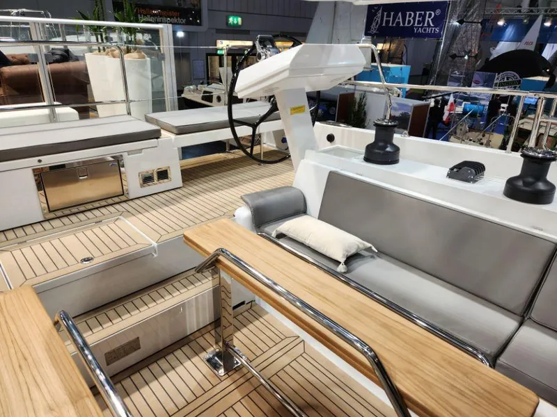 Slide: The Image of Luxurious 2025 Moody 48 DS yacht interior with sleek seating and modern helm station. - 29