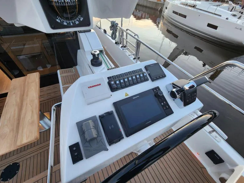 Slide: The Image of Helm station of 2025 Moody 48 DS yacht with navigation equipment and controls. - 33