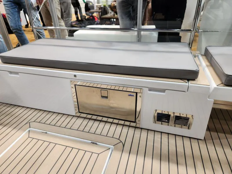 Slide: The Image of Luxury seating area on 2025 Moody 48 DS yacht with integrated storage and sleek design. - 38