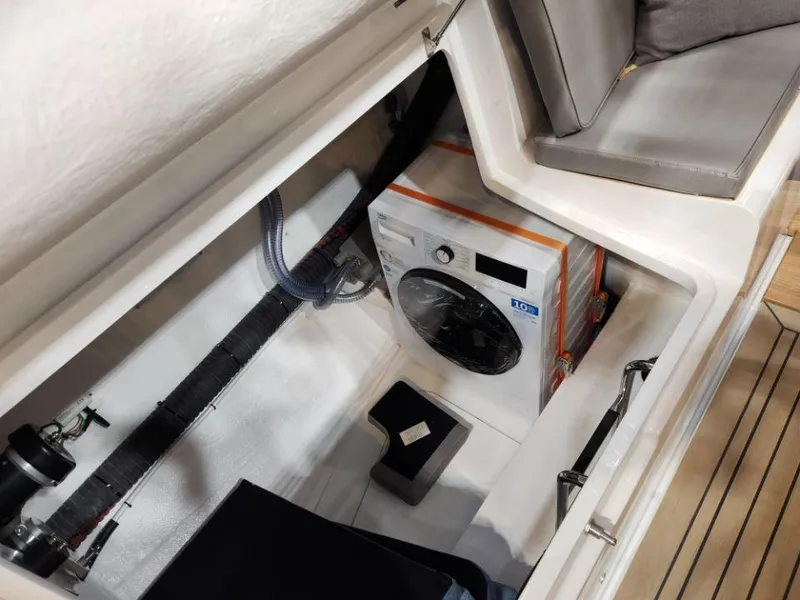Slide: The Image of Washing machine in storage compartment of 2025 Moody 48 DS yacht. - 39