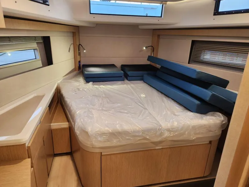Slide: The Image of Luxurious cabin interior of 2025 Moody 48 DS yacht with bed and seating. - 41