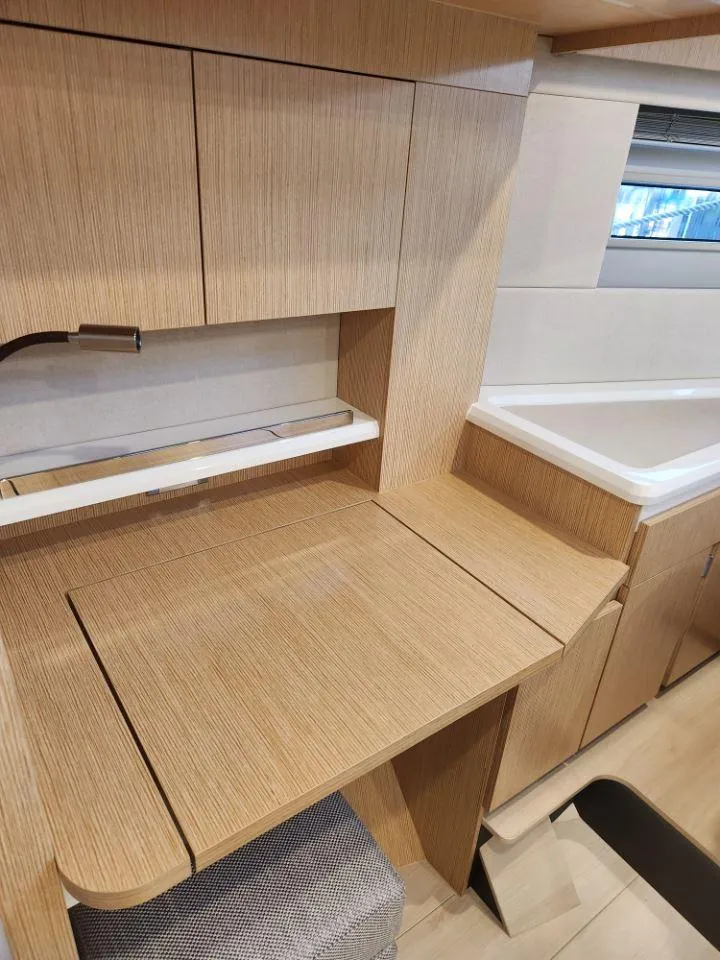 Slide: The Image of Modern interior of 2025 Moody 48 DS yacht with sleek wooden cabinetry. - 44