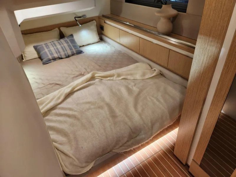 Slide: The Image of Luxurious bedroom interior of 2025 Moody 48 DS yacht with cozy bedding and modern decor. - 47