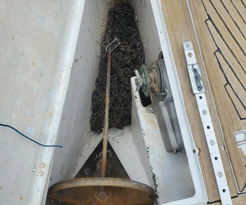 Slide: The Image of Anchor chain storage on 1984 Beneteau First 42 sailboat deck. - 11