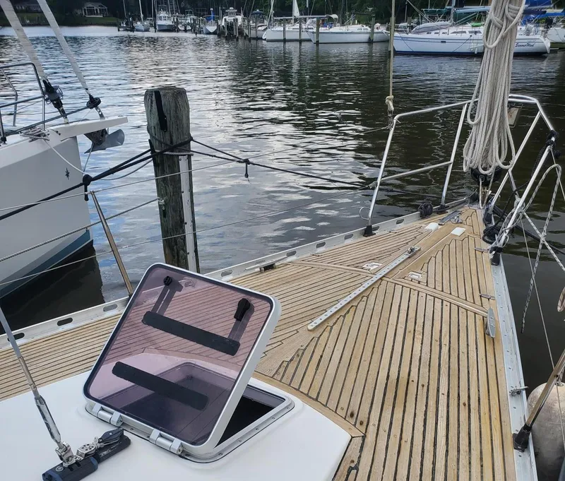 Slide: The Image of Beneteau First 42 sailboat deck, 1984 model, docked at a marina. - 14