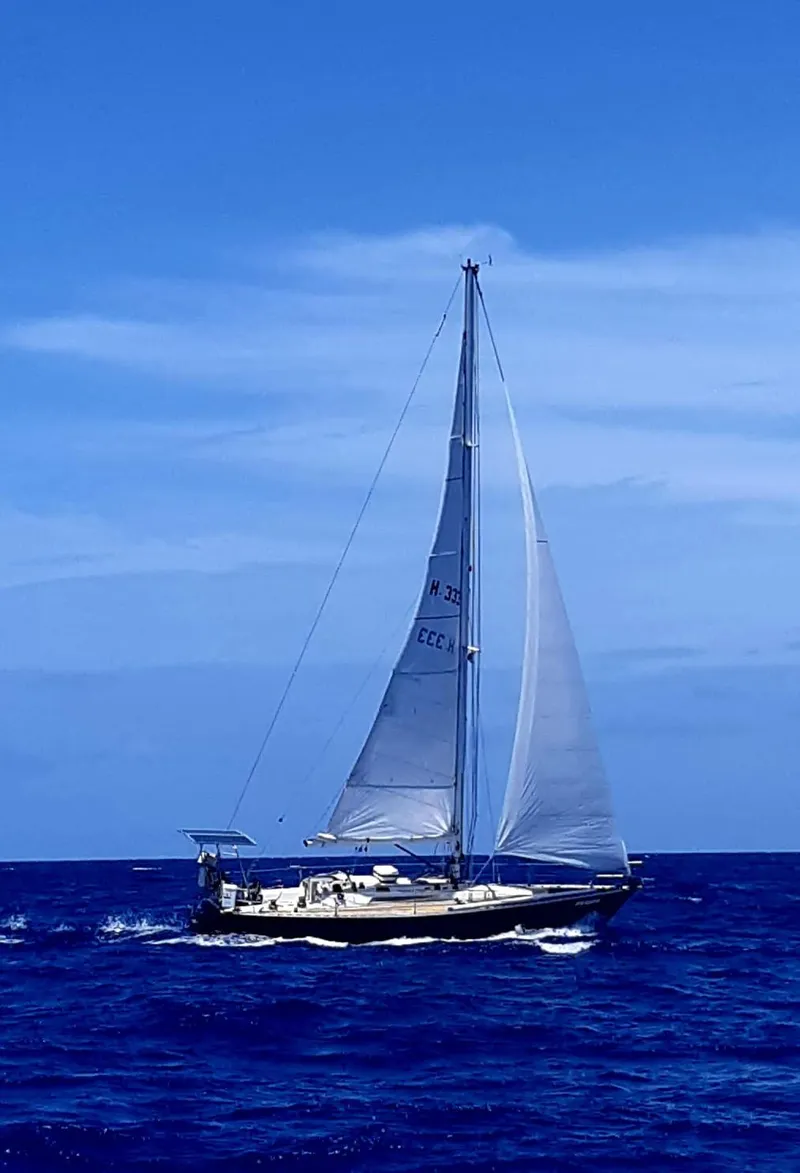Slide: The Image of Sailing yacht Beneteau First 42, 1984 model, cruising on open blue sea. - 2