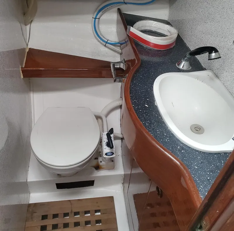 Slide: The Image of 1984 Beneteau First 42 yacht bathroom with toilet and sink. - 28