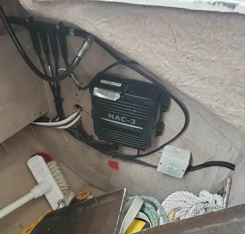 Slide: The Image of NAC-3 unit in 1984 Beneteau First 42 sailboat interior with ropes and cleaning tools. - 33