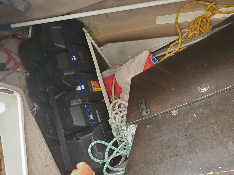Slide: The Image of Storage compartment of a 1984 Beneteau First 42 sailboat with ropes and equipment. - 38