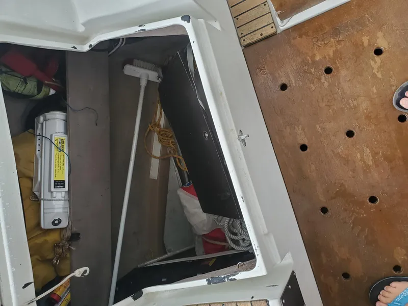 Slide: The Image of Storage compartment on 1984 Beneteau First 42 sailboat with equipment and wooden deck. - 41