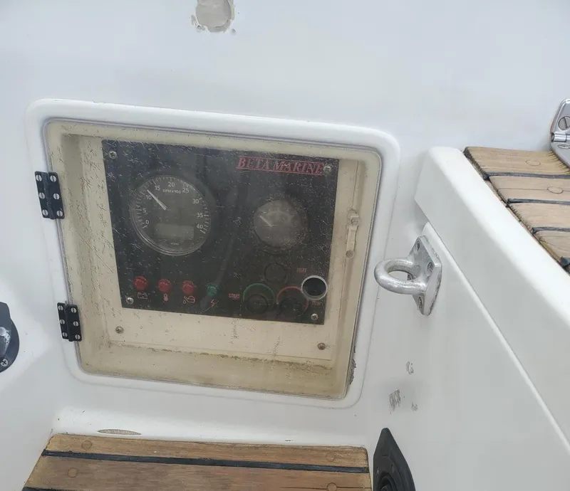 Slide: The Image of Control panel on a 1984 Beneteau First 42 sailboat with wooden deck accents. - 42