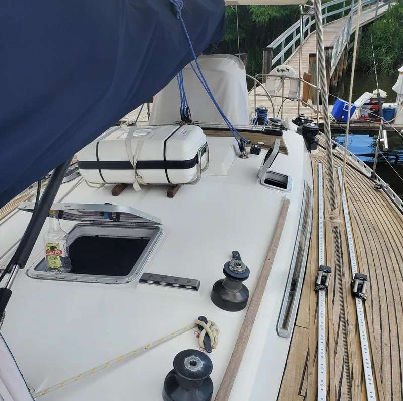 Slide: The Image of 1984 Beneteau First 42 sailboat deck with winches and rigging. - 8