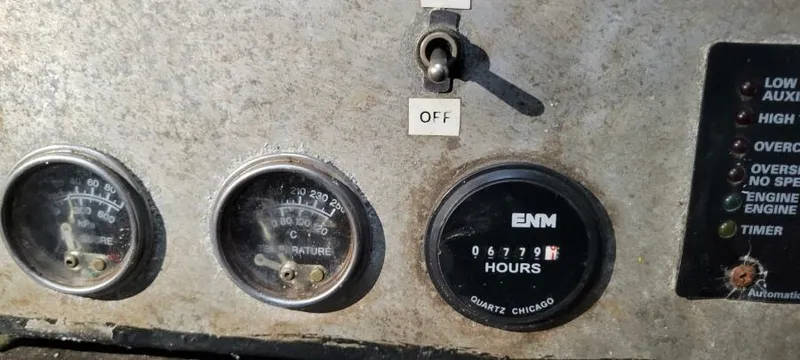 Slide: The Image of Control panel of a 1979 Blount 130 Dinner Cruise with gauges and switches. - 30