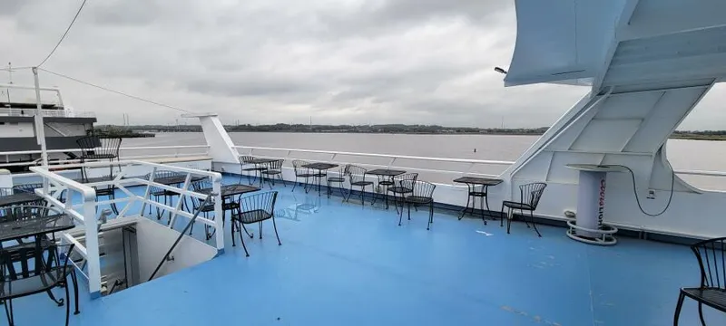 Slide: The Image of Open deck of 1979 Blount 130 Dinner Cruise ship with tables and chairs. - 6