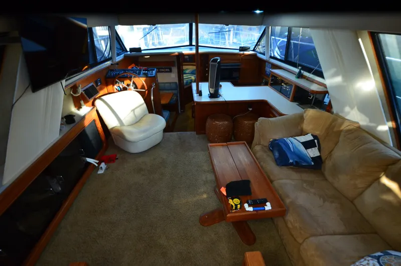 Slide: The Image of Interior of 1988 Carver 4207 Aft Cabin MY with cozy seating and helm station. - 12