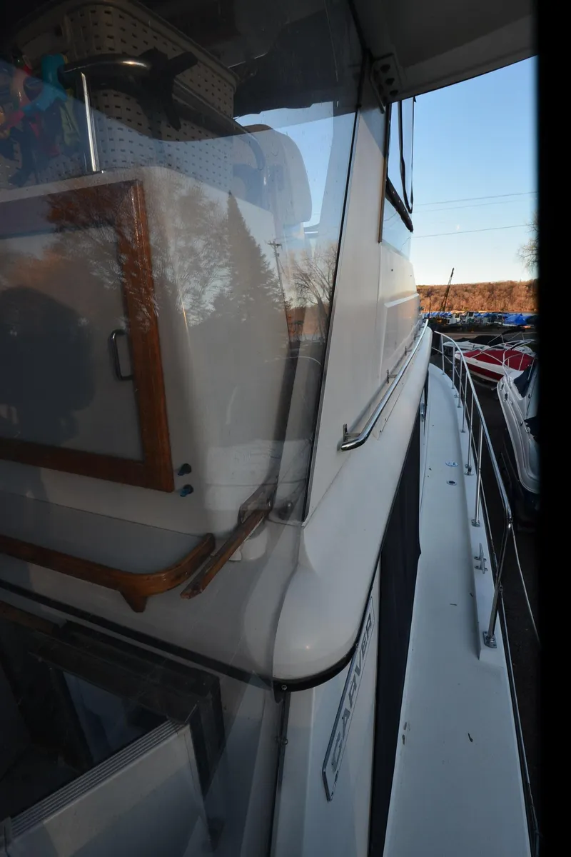 Slide: The Image of 1988 Carver 4207 Aft Cabin MY yacht, side view with cabin details. - 36
