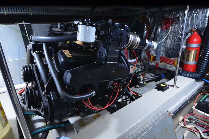 Slide: The Image of Engine room of 1988 Carver 4207 Aft Cabin MY with visible machinery and components. - 42