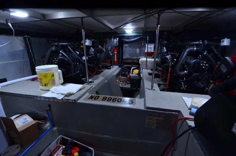 Slide: The Image of Engine room of 1988 Carver 4207 Aft Cabin MY with visible equipment and tools. - 43