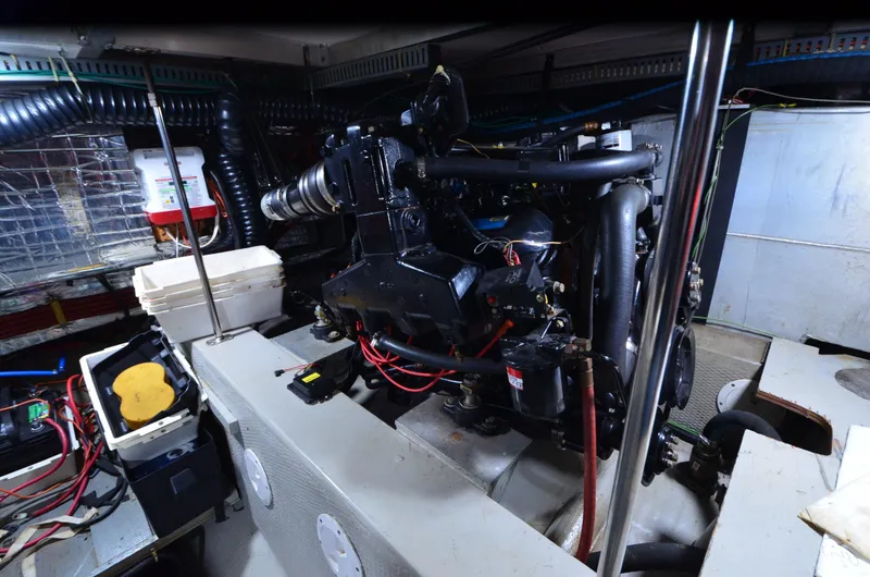 Slide: The Image of Engine room of 1988 Carver 4207 Aft Cabin MY with visible machinery and components. - 44