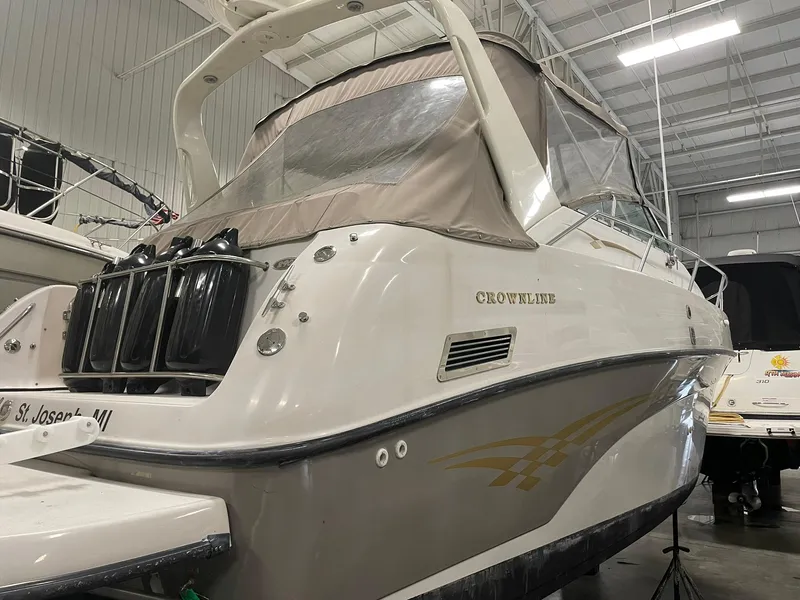 Slide: The Image of 2000 Crownline 290 CR boat in indoor storage, rear view. - 11