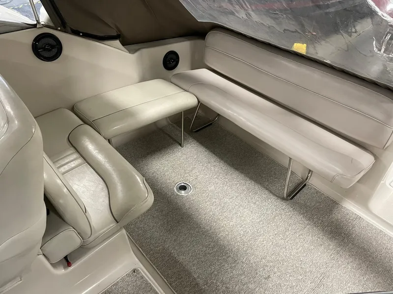 Slide: The Image of Crownline 290 CR 2000 boat interior with beige seating and carpeted floor. - 17