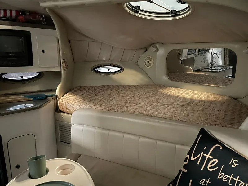 Slide: The Image of Interior of 2000 Crownline 290 CR boat with cozy bed and modern amenities. - 20